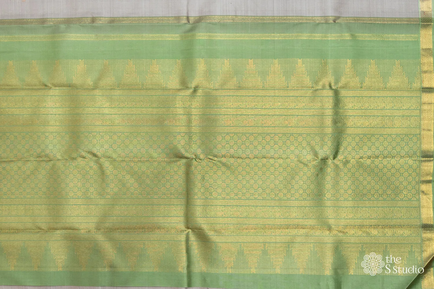 Grey kanchipuram silk saree with green border
